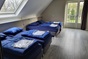 Das Schlafzimmer der Gruppenunterkunft in IJhorst und Holland fr 23 Personen
